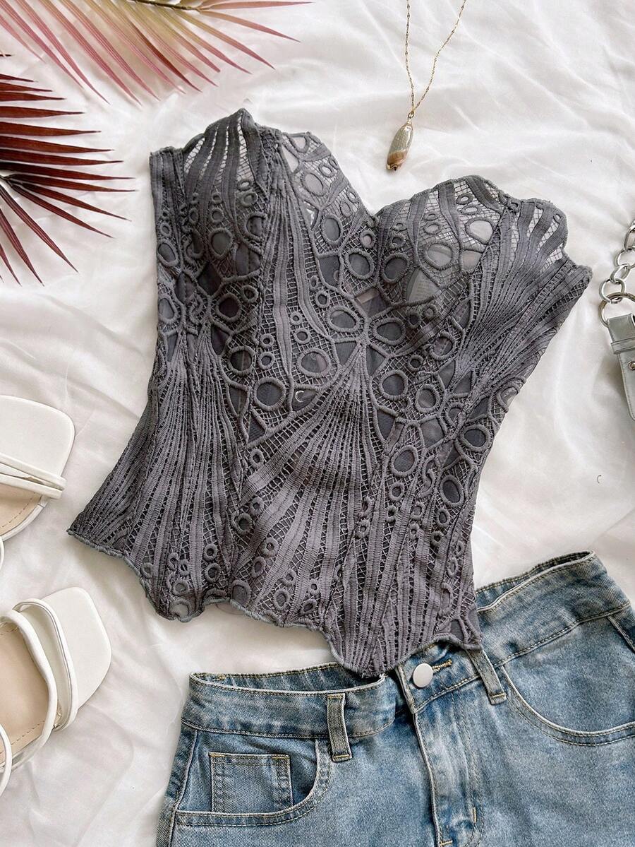 Women’s strapless corset bustier top with lace-up detail, asymmetrical embroidery, semi-sheer finish, and slim fit.