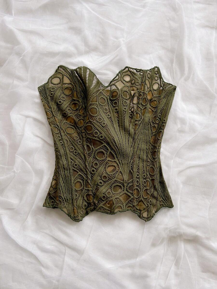 Women’s strapless corset bustier top with lace-up detail, asymmetrical embroidery, semi-sheer finish, and slim fit.