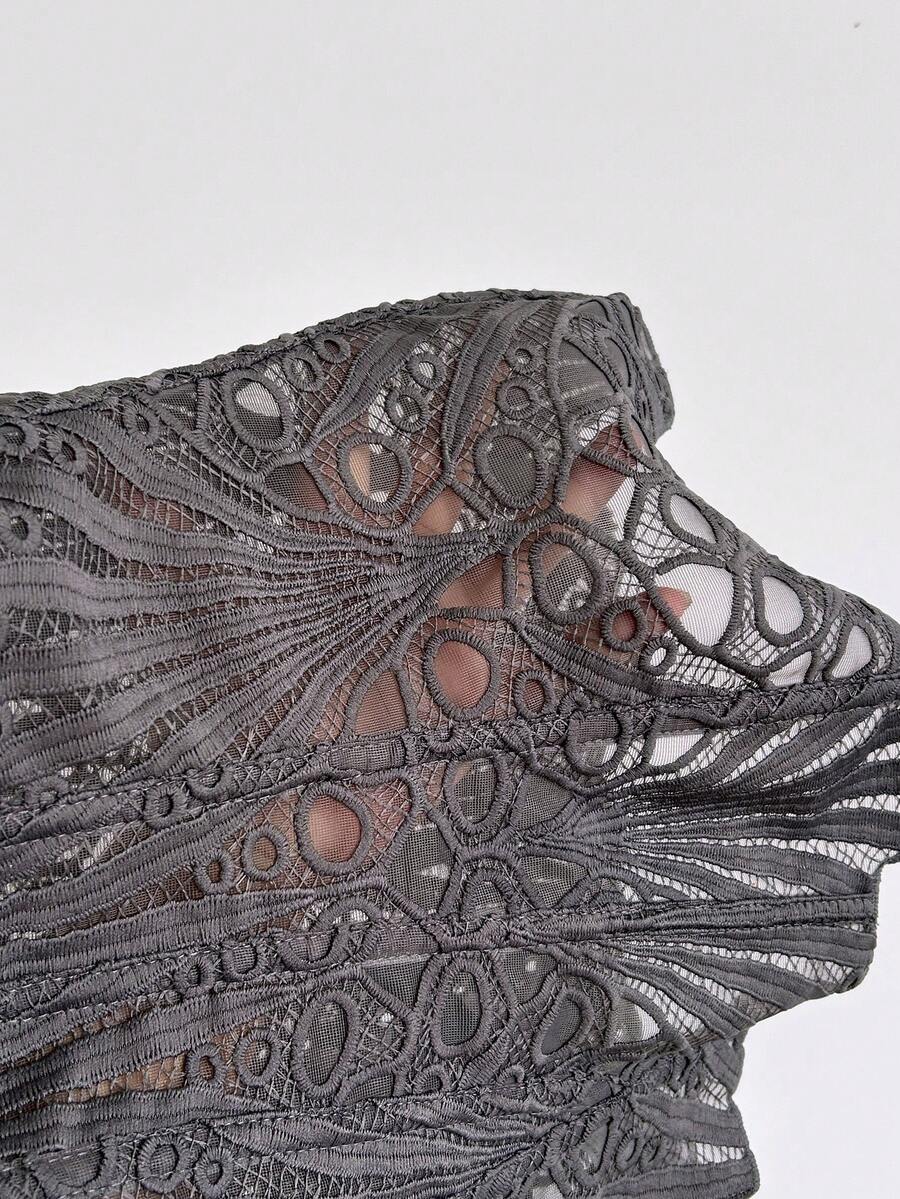 Women’s strapless corset bustier top with lace-up detail, asymmetrical embroidery, semi-sheer finish, and slim fit.