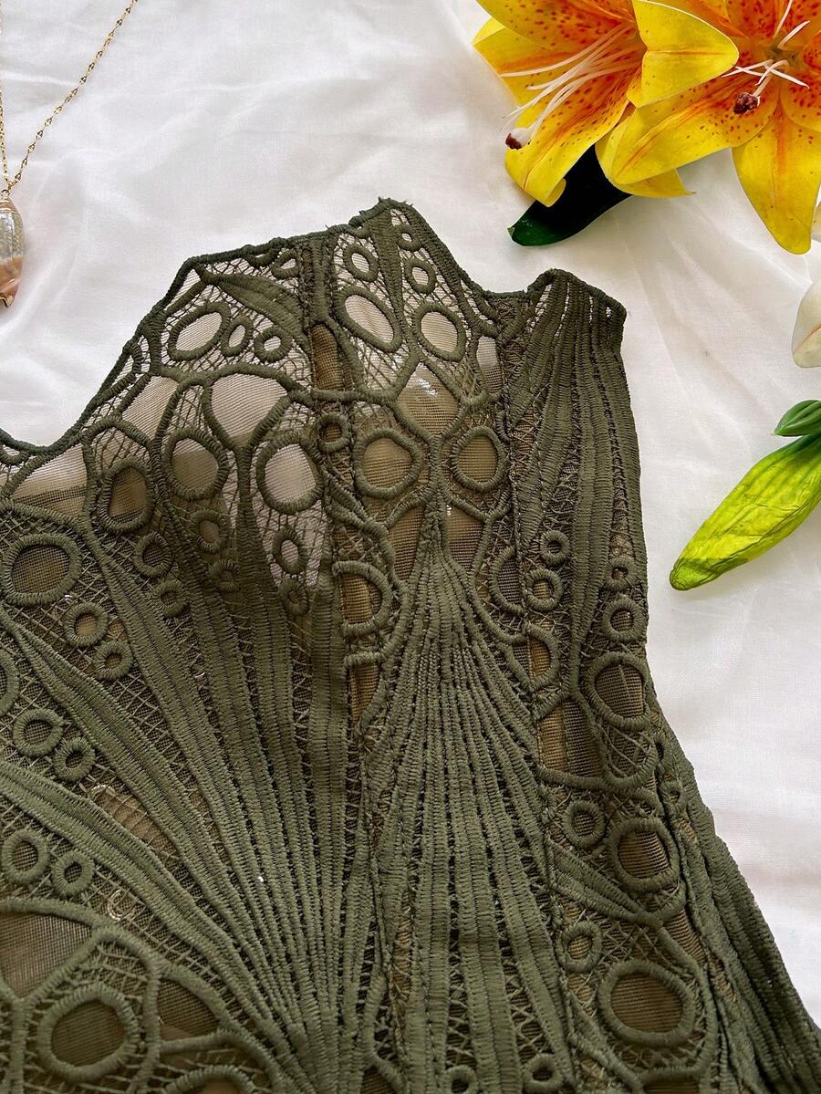 Women’s strapless corset bustier top with lace-up detail, asymmetrical embroidery, semi-sheer finish, and slim fit.