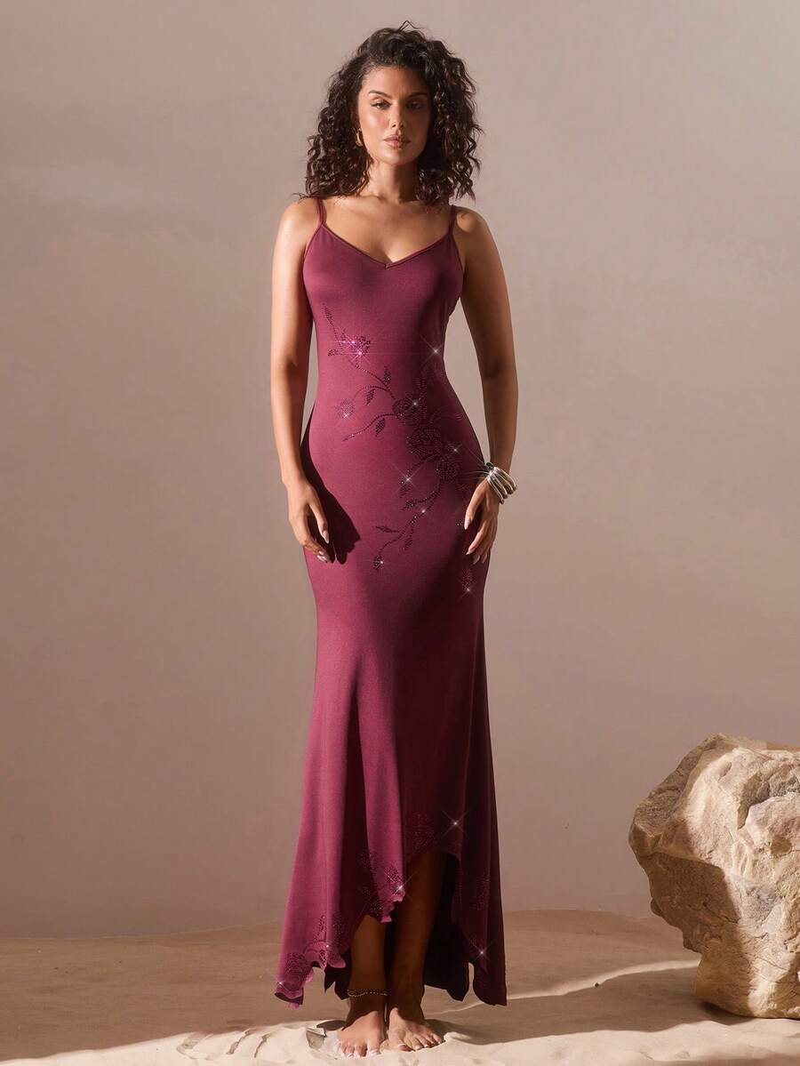 Black sleeveless asymmetrical cami maxi dress for women featuring spaghetti straps, 3D rose accent, arm sleeves, and a slim fit knitted design.