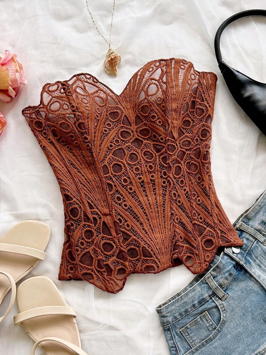 Women’s strapless corset bustier top with lace-up detail, asymmetrical embroidery, semi-sheer finish, and slim fit.
