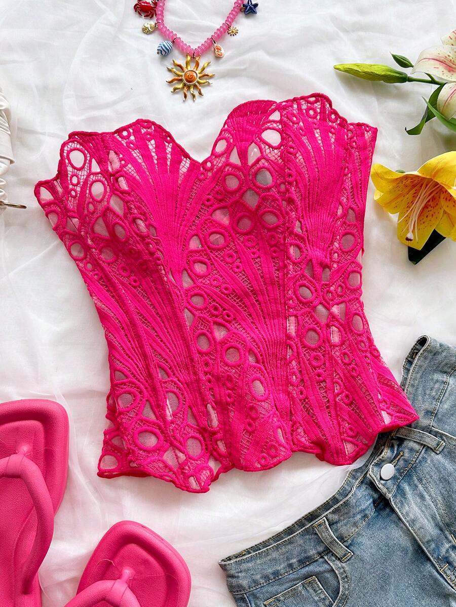 Women’s strapless corset bustier top with lace-up detail, asymmetrical embroidery, semi-sheer finish, and slim fit.