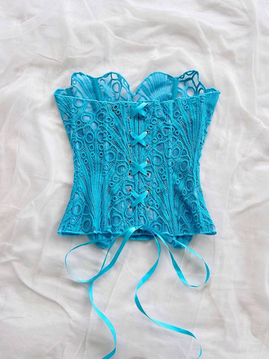 Women’s strapless corset bustier top with lace-up detail, asymmetrical embroidery, semi-sheer finish, and slim fit.