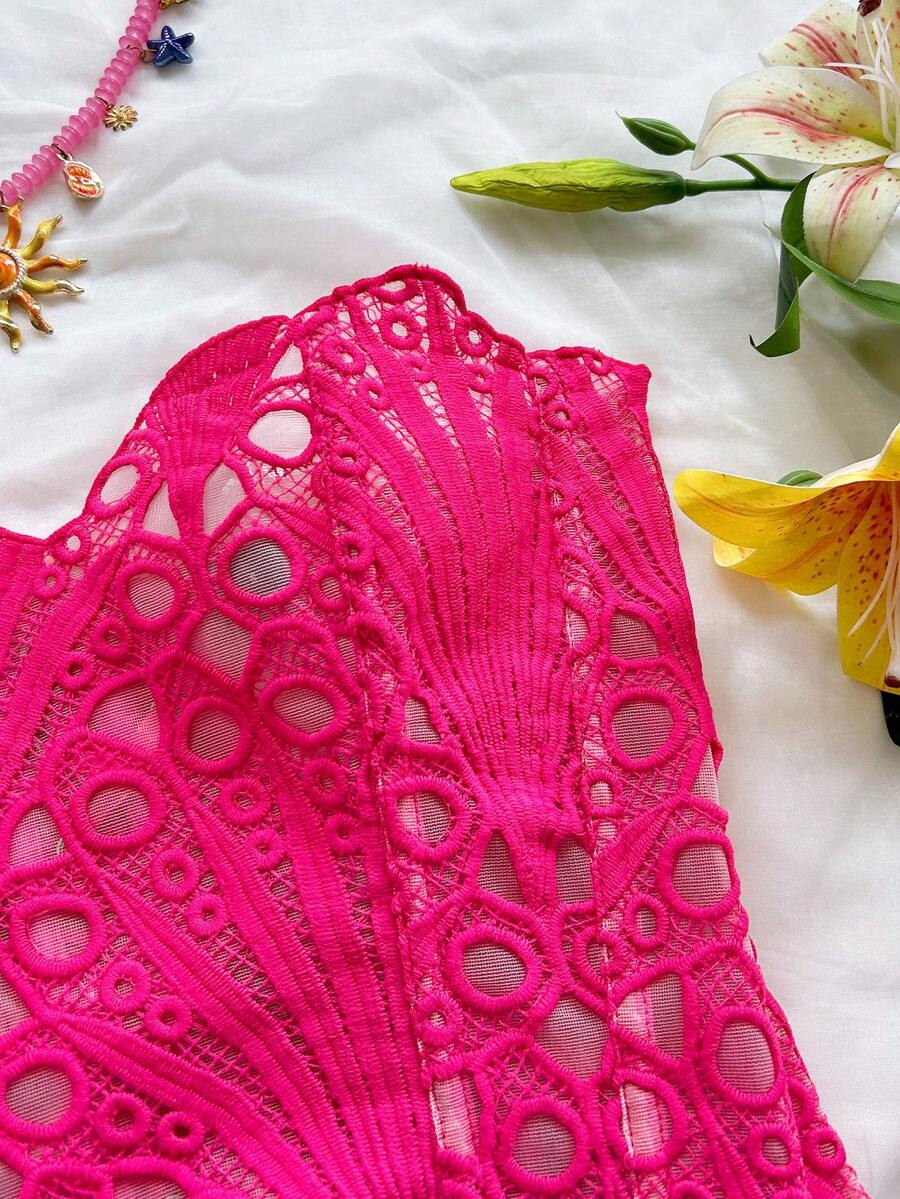 Women’s strapless corset bustier top with lace-up detail, asymmetrical embroidery, semi-sheer finish, and slim fit.