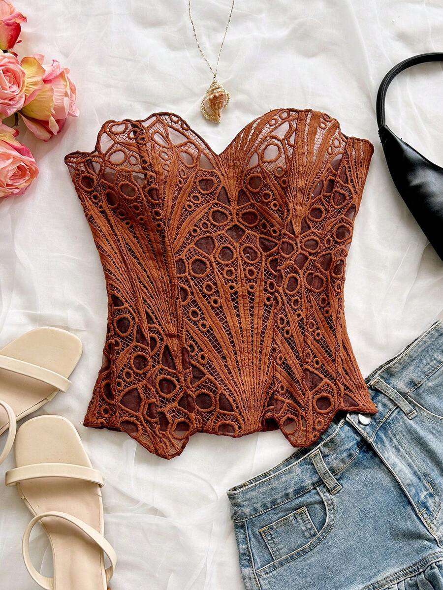 Women’s strapless corset bustier top with lace-up detail, asymmetrical embroidery, semi-sheer finish, and slim fit.