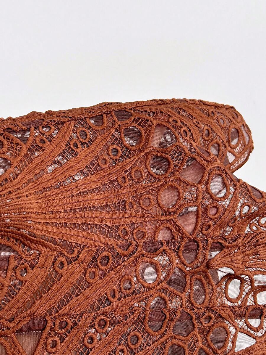 Women’s strapless corset bustier top with lace-up detail, asymmetrical embroidery, semi-sheer finish, and slim fit.