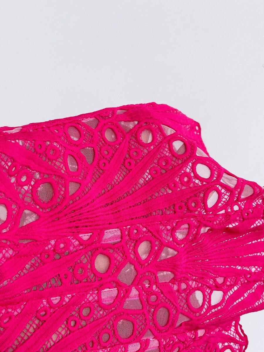 Women’s strapless corset bustier top with lace-up detail, asymmetrical embroidery, semi-sheer finish, and slim fit.