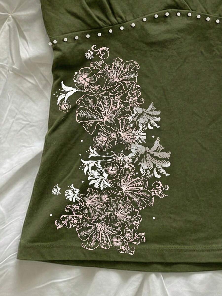 Women's slim fit spaghetti strap cami top featuring a tropical hibiscus floral graphic print.