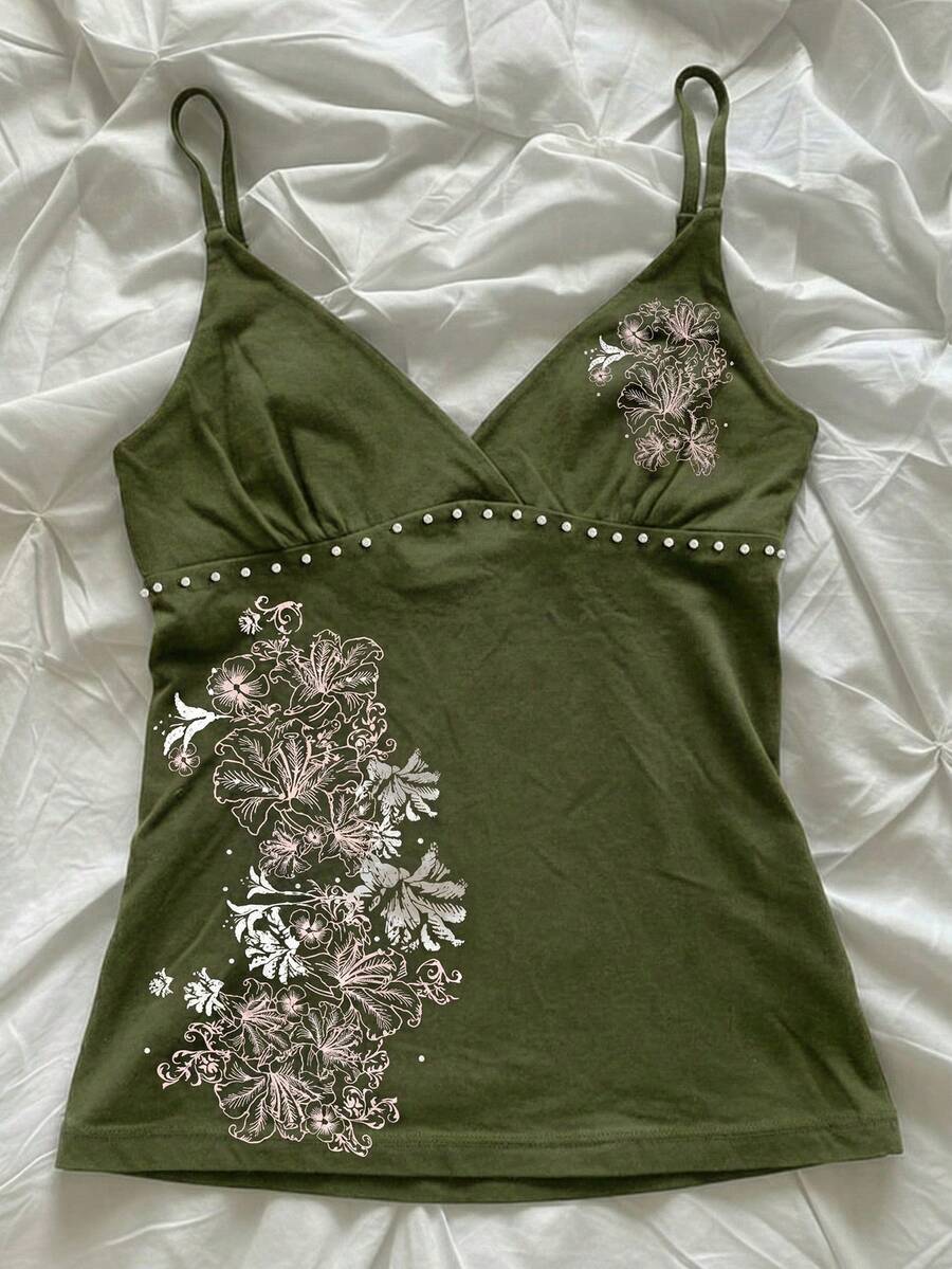 Women's slim fit spaghetti strap cami top featuring a tropical hibiscus floral graphic print.