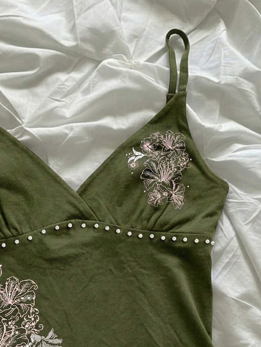 Women's slim fit spaghetti strap cami top featuring a tropical hibiscus floral graphic print.