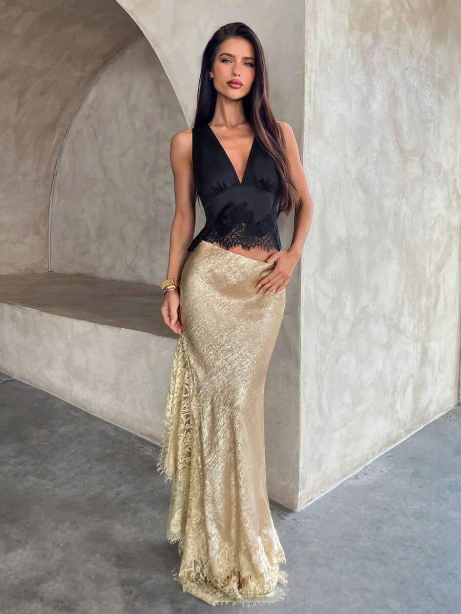 Women's elegant black lace patchwork mermaid maxi skirt featuring asymmetrical contrast lace design and low waist fit.