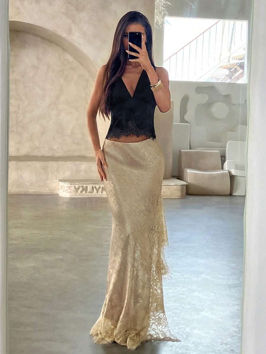 Women's elegant black lace patchwork mermaid maxi skirt featuring asymmetrical contrast lace design and low waist fit.