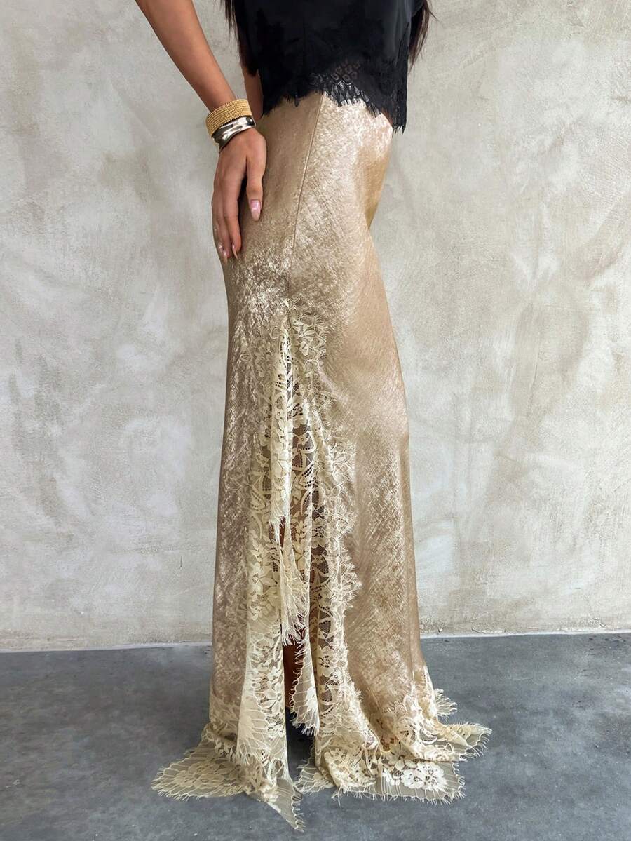 Women's elegant black lace patchwork mermaid maxi skirt featuring asymmetrical contrast lace design and low waist fit.