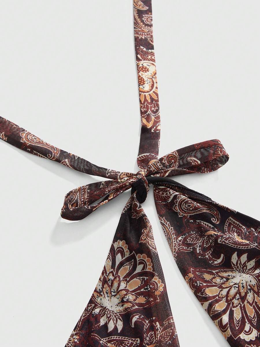 Multicolor paisley print halter bodycon mini dress for women featuring a backless tie-back design in sleeveless mesh fabric.