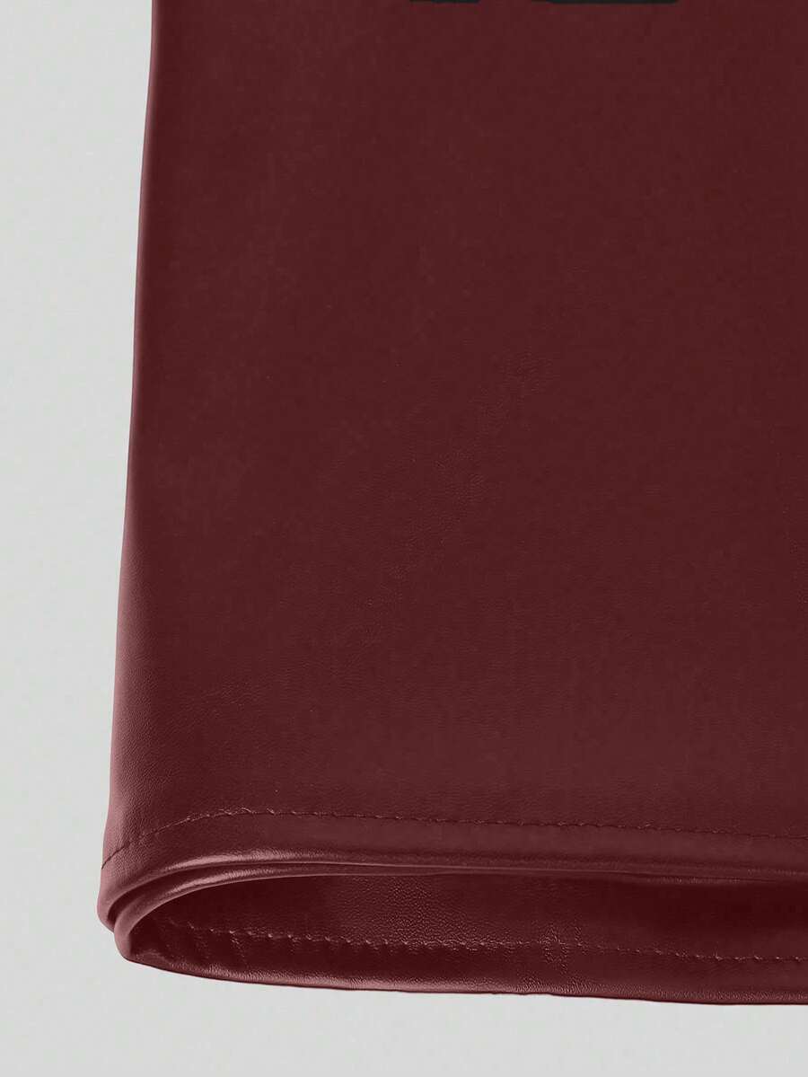 Women's black Y2K low waist PU leather mini skirt with zipper detail