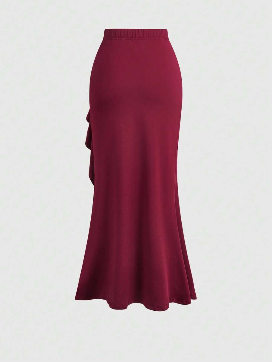 Women's ruffled slit hem skirt in black with criss-cross details, split thigh, skinny mermaid fit, and mid-waist style.