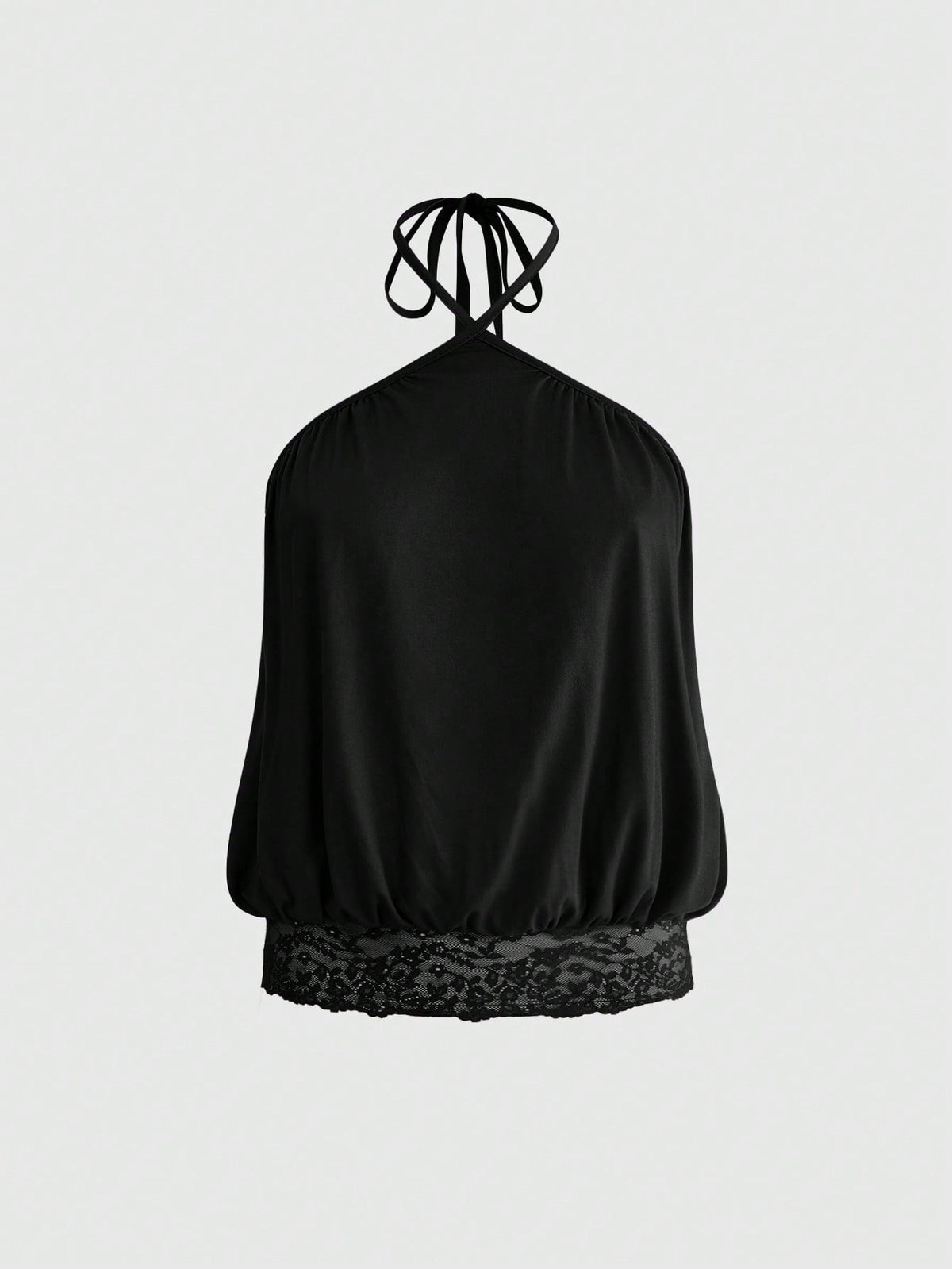 Woman wearing a black slim fit halter camisole crop top with lace-up backless tie detail.