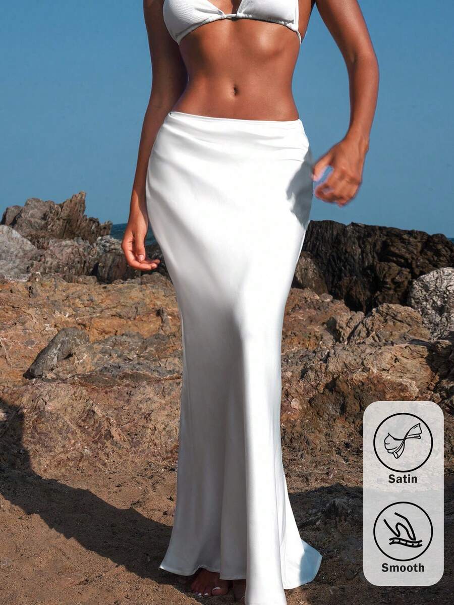 Women's black woven mermaid maxi skirt featuring a solid color design, mid waist, and 100% cotton fabric.