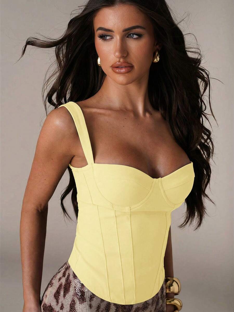 Women's slim fit tank top with rhinestone detail, wide straps, and a short length for casual beach wear.