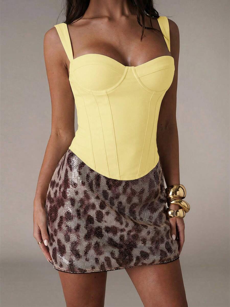 Women's slim fit tank top with rhinestone detail, wide straps, and a short length for casual beach wear.