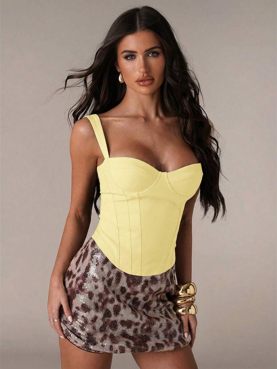Women's slim fit tank top with rhinestone detail, wide straps, and a short length for casual beach wear.