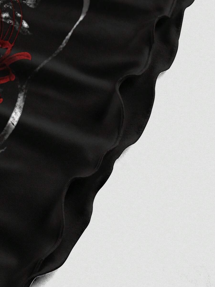 Women's black backless cami mini dress featuring spaghetti straps, lettuce trim detail, high waist, and a flared hem design.