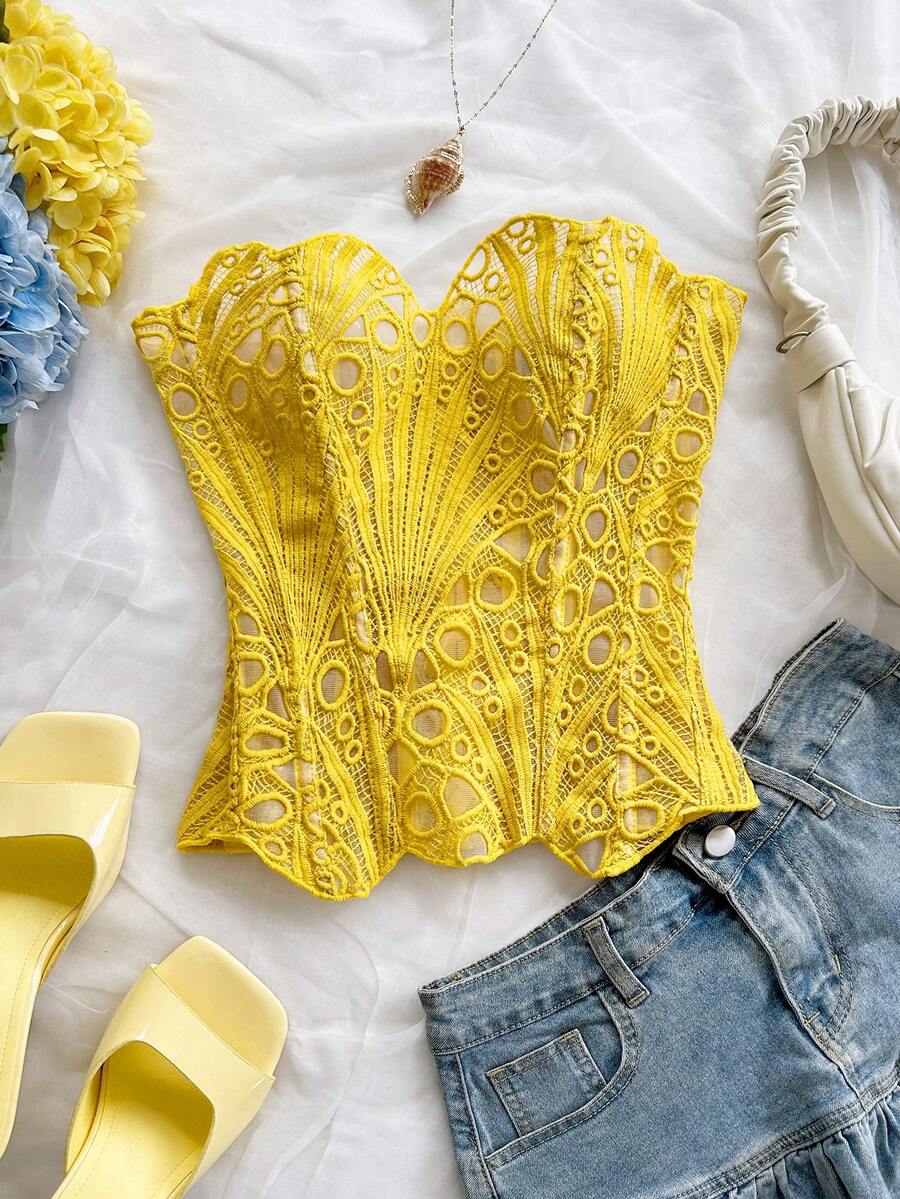 Women’s strapless corset bustier top with lace-up detail, asymmetrical embroidery, semi-sheer finish, and slim fit.
