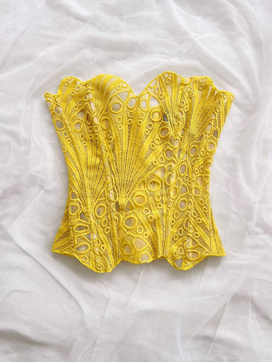 Women’s strapless corset bustier top with lace-up detail, asymmetrical embroidery, semi-sheer finish, and slim fit.