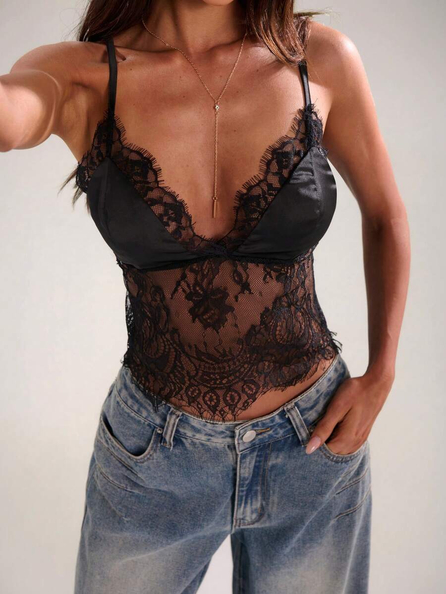 Women's black lace patchwork camisole top featuring spaghetti straps and backless design