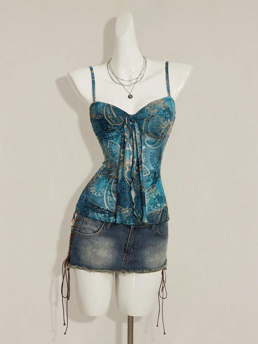 Burgundy paisley print ruched cami top for women featuring thin spaghetti straps, asymmetrical lace-up detail, and a slim fit.