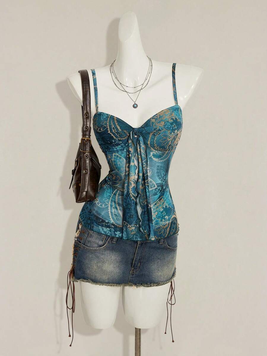 Burgundy paisley print ruched cami top for women featuring thin spaghetti straps, asymmetrical lace-up detail, and a slim fit.