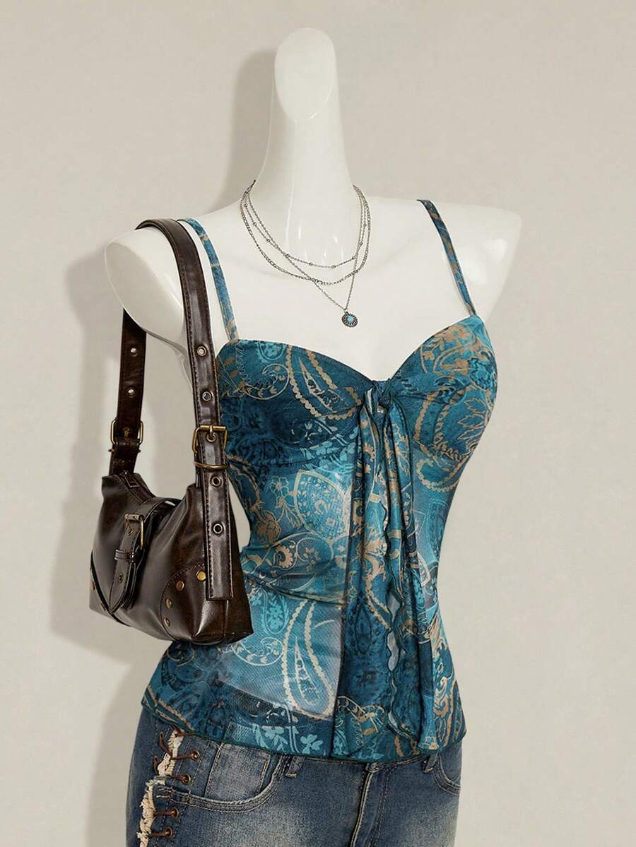 Burgundy paisley print ruched cami top for women featuring thin spaghetti straps, asymmetrical lace-up detail, and a slim fit.