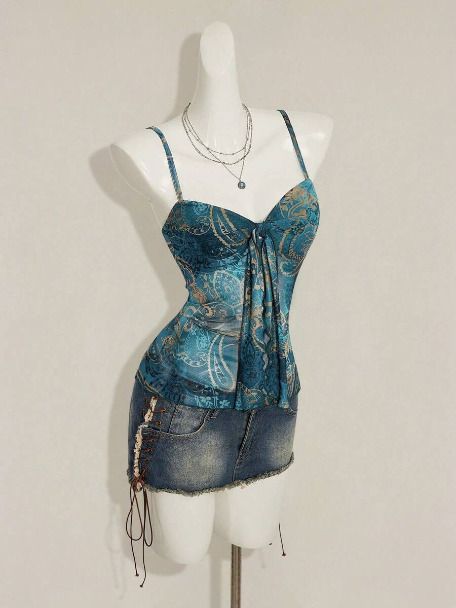 Burgundy paisley print ruched cami top for women featuring thin spaghetti straps, asymmetrical lace-up detail, and a slim fit.