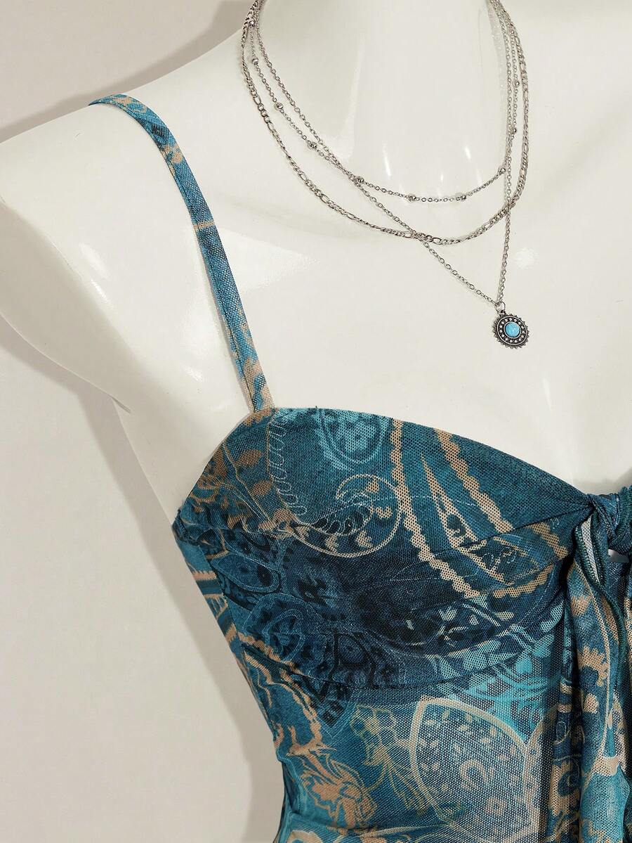 Burgundy paisley print ruched cami top for women featuring thin spaghetti straps, asymmetrical lace-up detail, and a slim fit.
