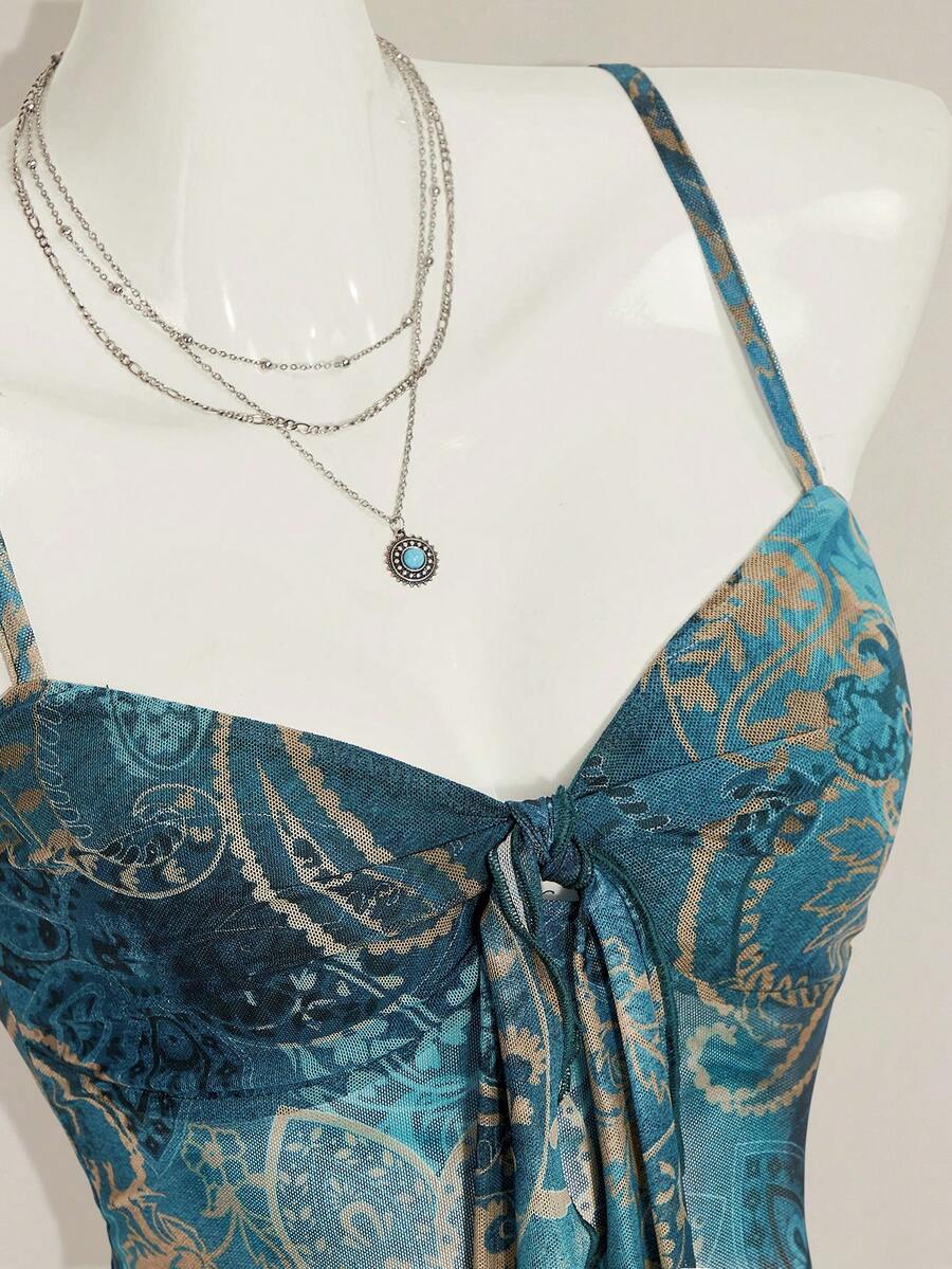 Burgundy paisley print ruched cami top for women featuring thin spaghetti straps, asymmetrical lace-up detail, and a slim fit.