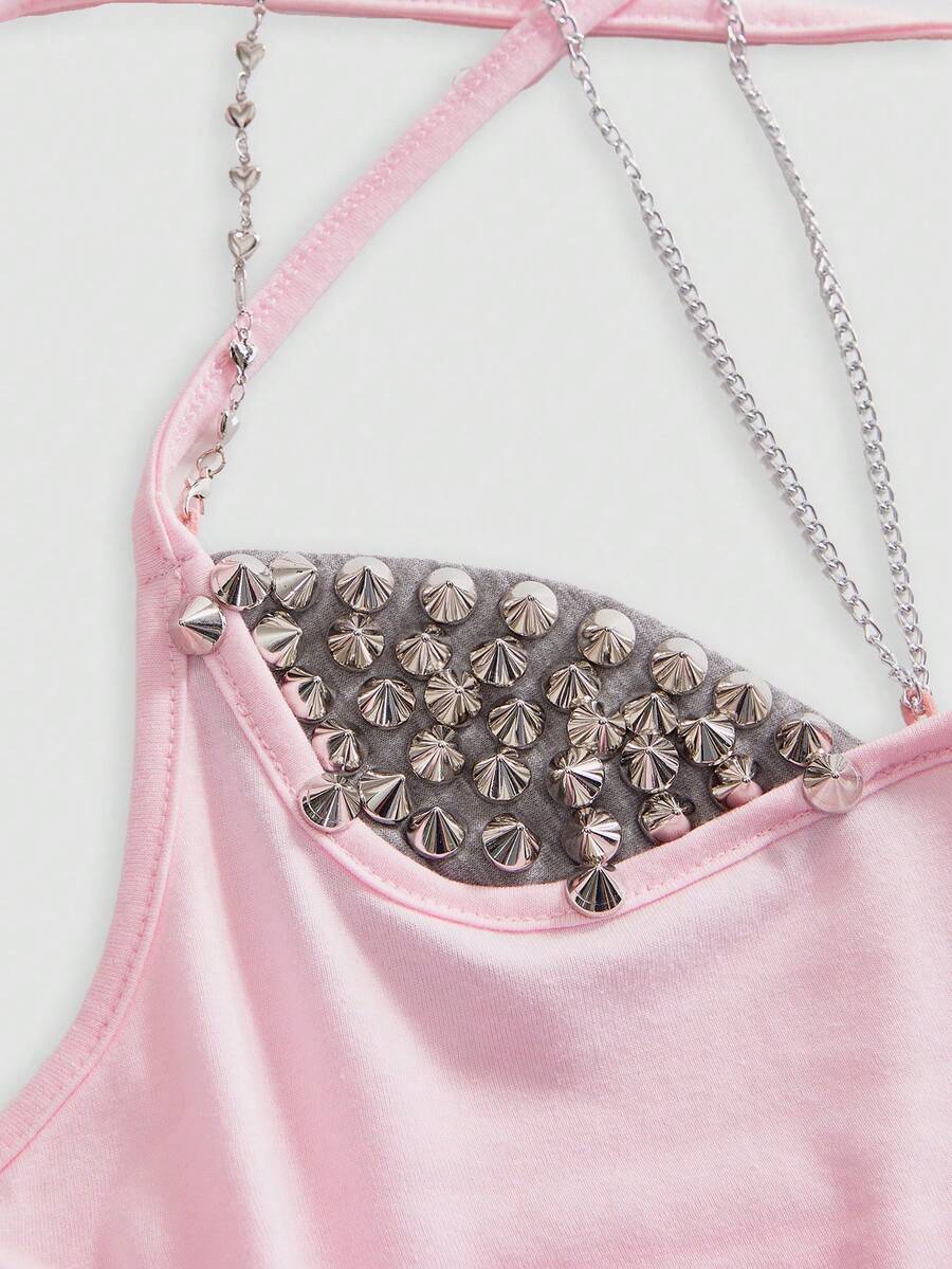 Women's black halter backless crop top with criss cross knot design and spaghetti straps.