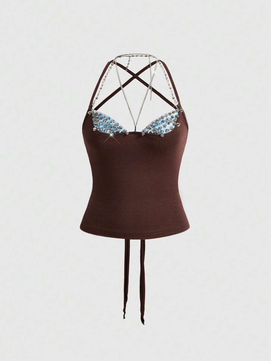 Women's black halter backless crop top with criss cross knot design and spaghetti straps.