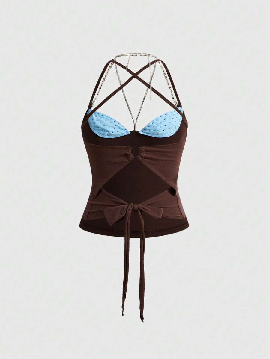 Women's black halter backless crop top with criss cross knot design and spaghetti straps.