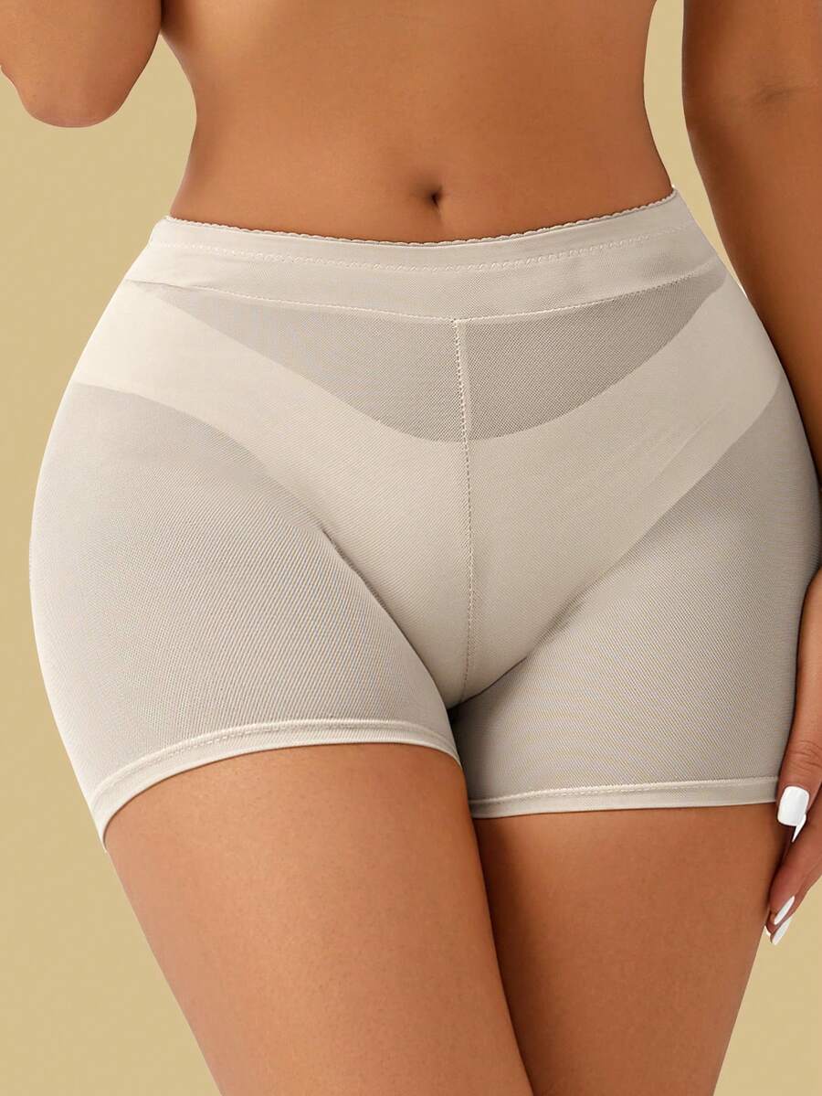 Apricot high-waist seamless butt lifting shapewear shorts with removable foam padding for women.