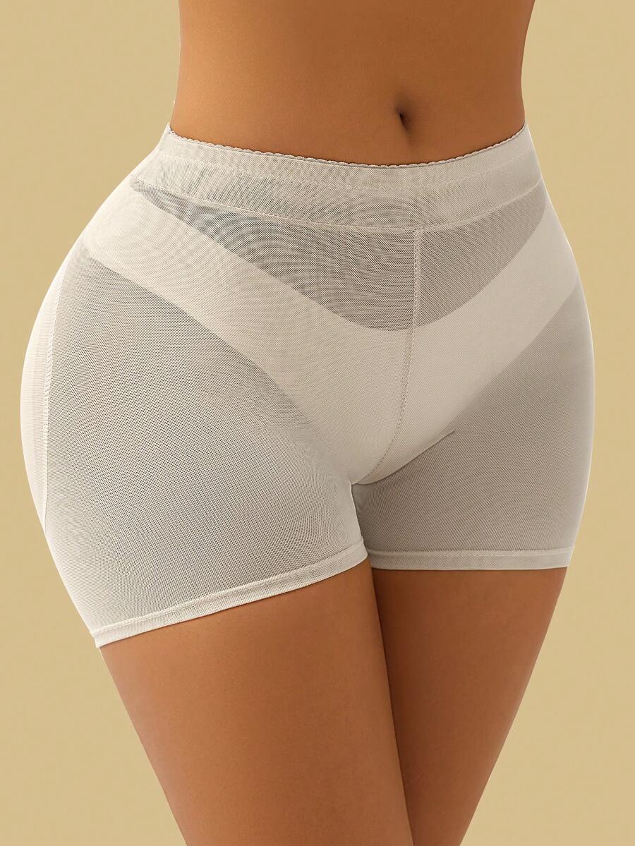 Apricot high-waist seamless butt lifting shapewear shorts with removable foam padding for women.