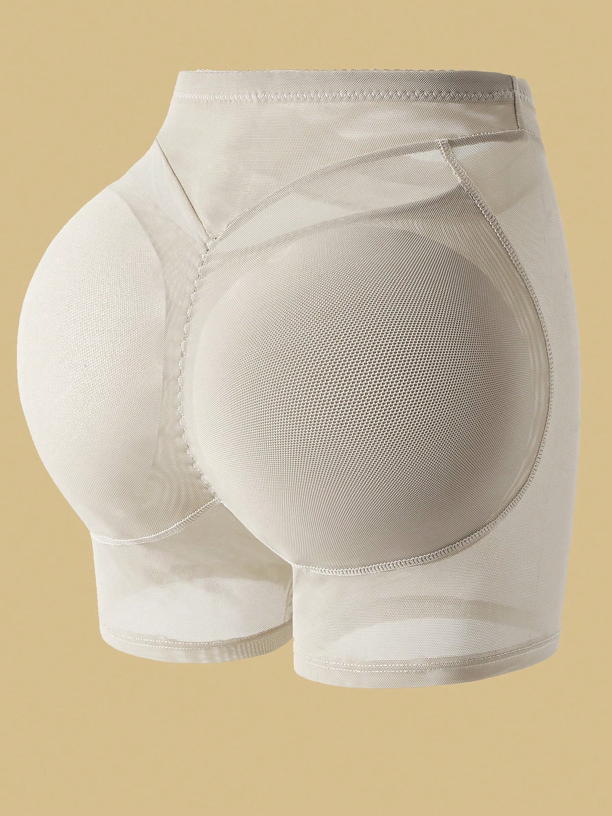 Apricot high-waist seamless butt lifting shapewear shorts with removable foam padding for women.