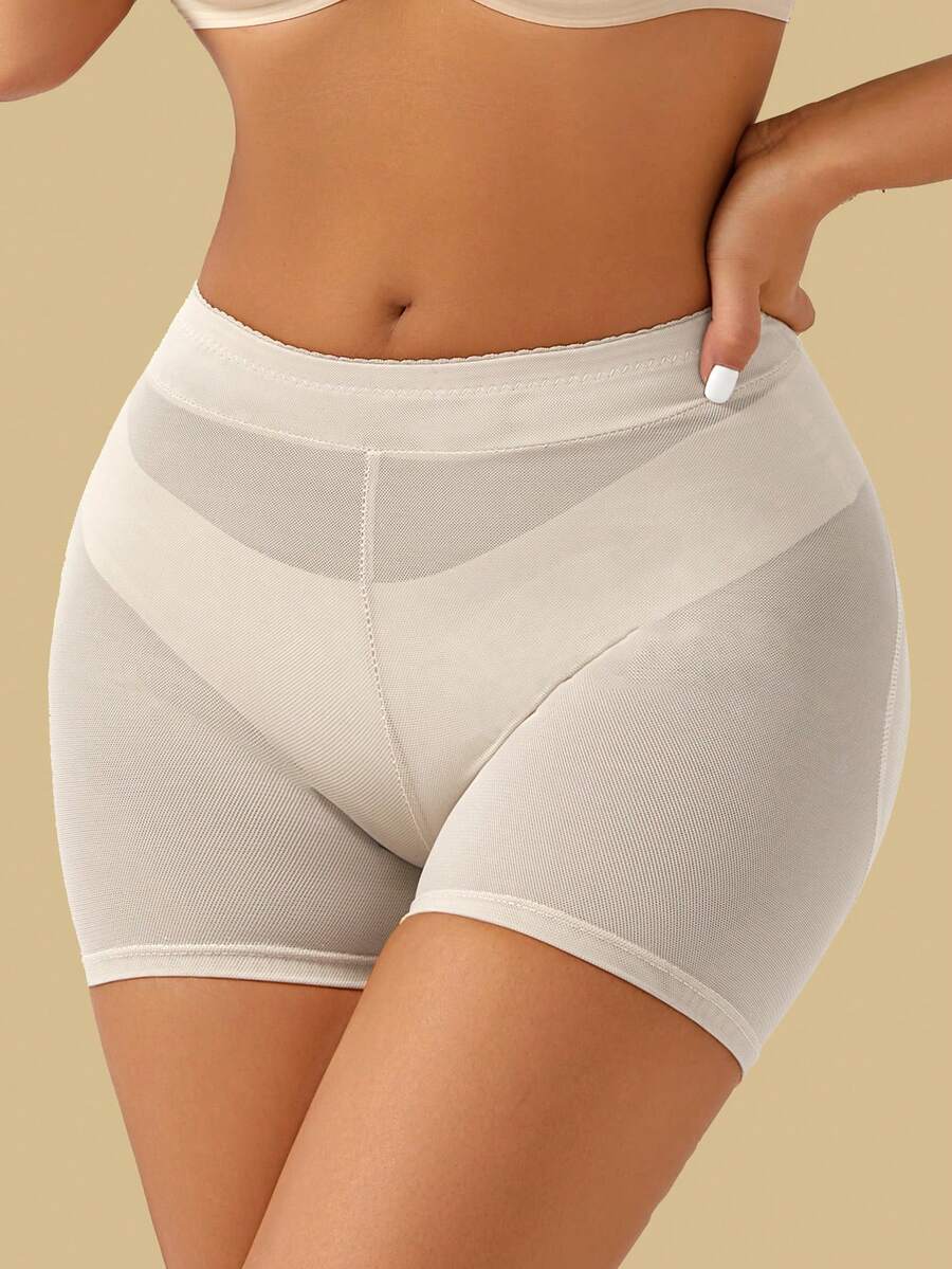 Apricot high-waist seamless butt lifting shapewear shorts with removable foam padding for women.