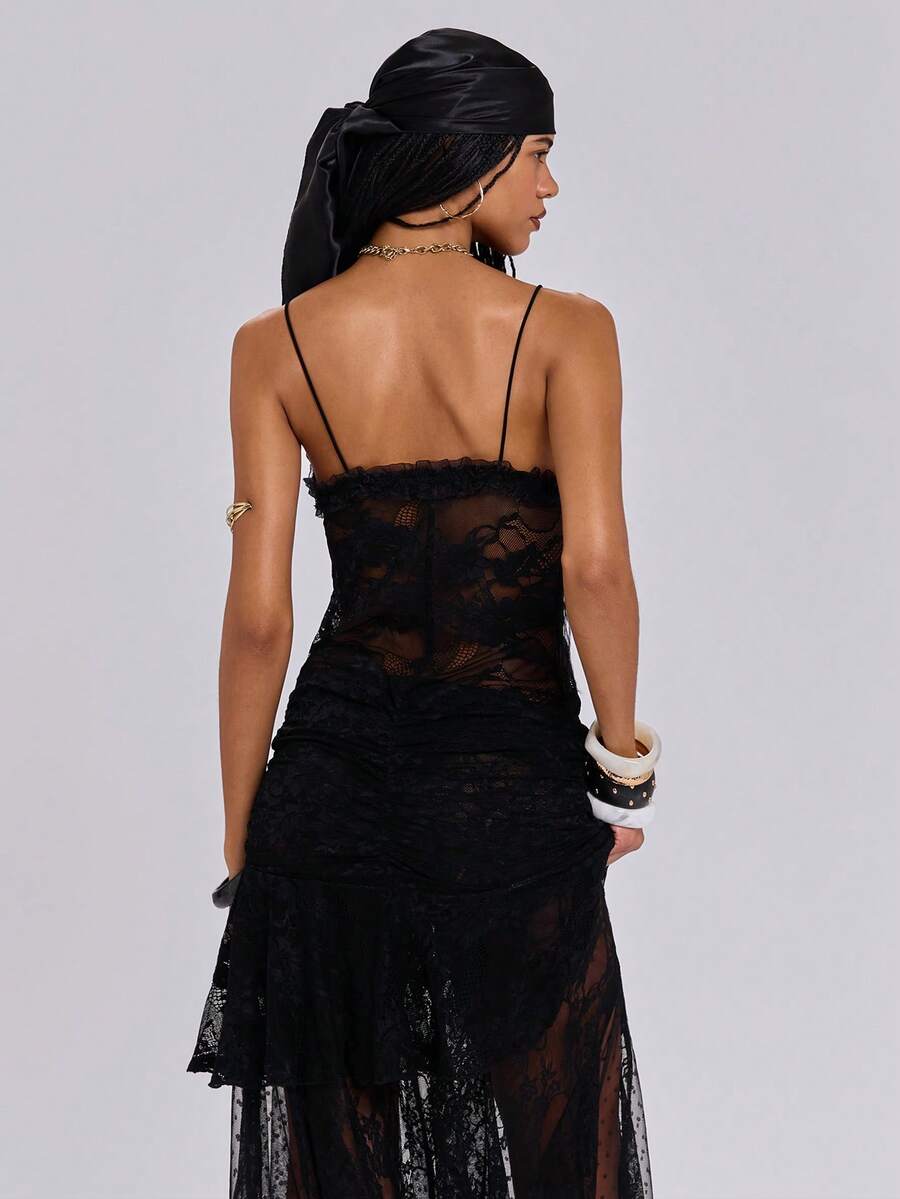 Women's black lace patchwork mini cami dress with spaghetti straps, contrast mesh, and side slit.