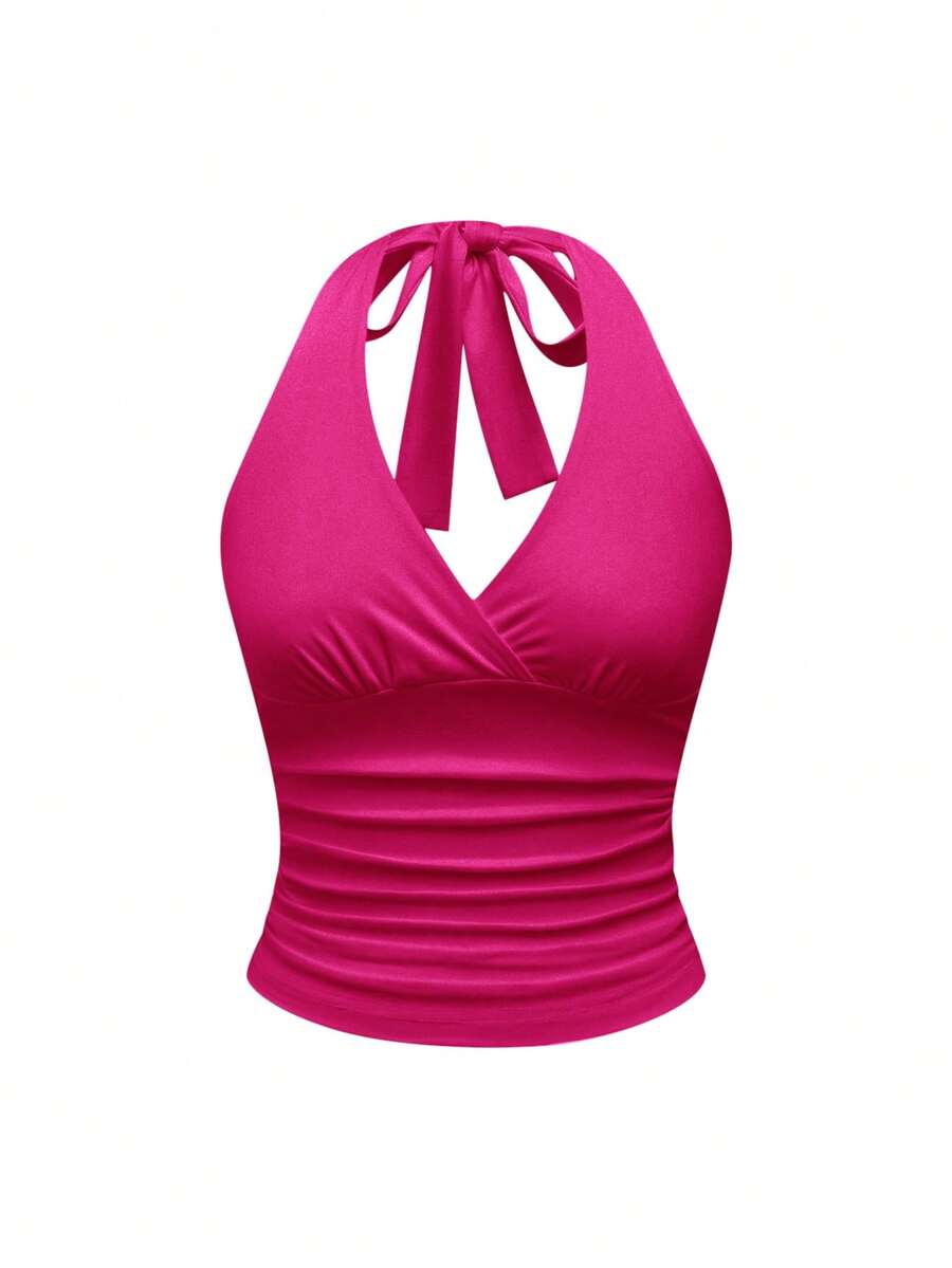 Women's halter crop tank top featuring a backless silhouette and ruched detailing in a slim fit design.