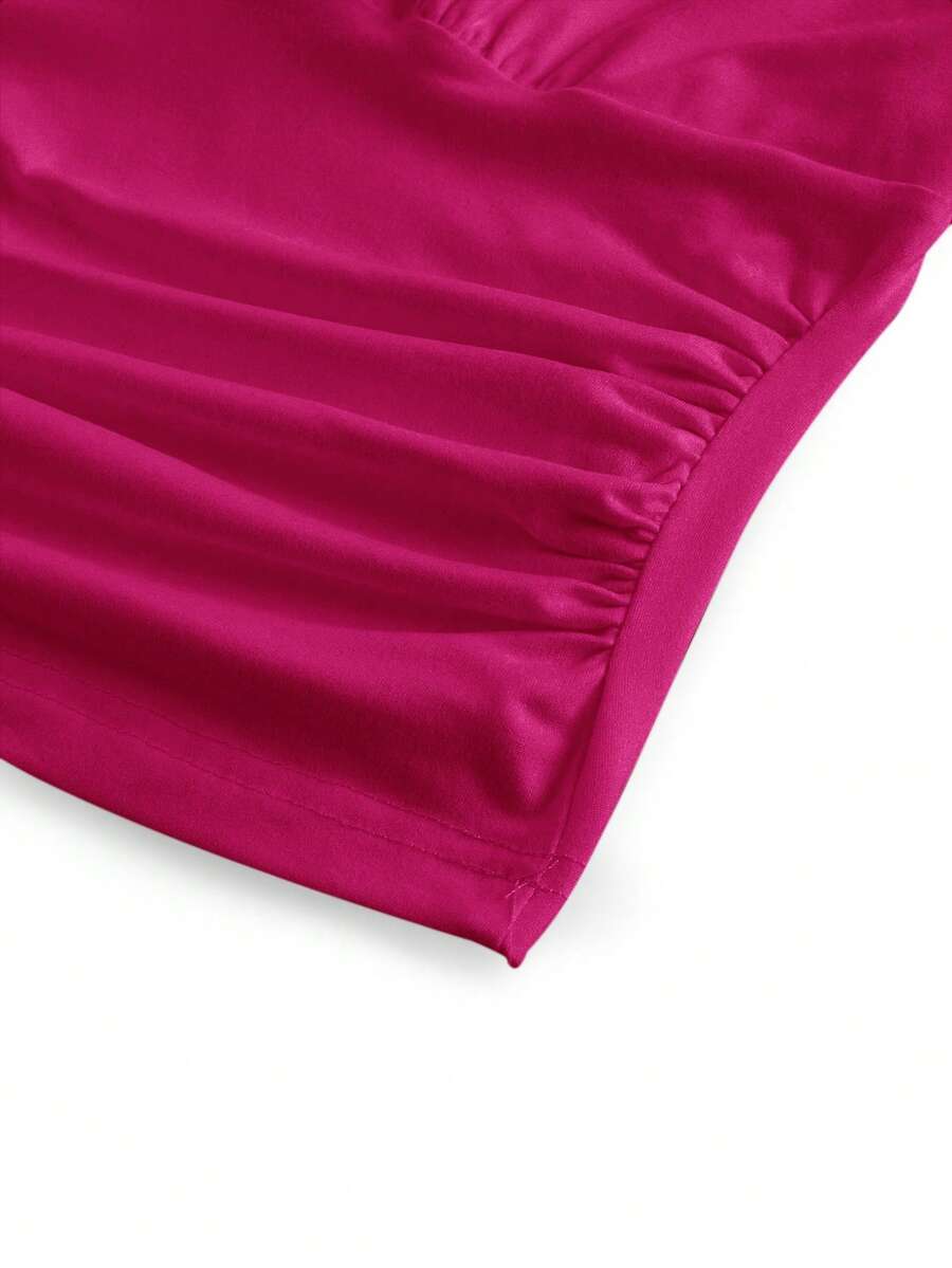 Women's halter crop tank top featuring a backless silhouette and ruched detailing in a slim fit design.