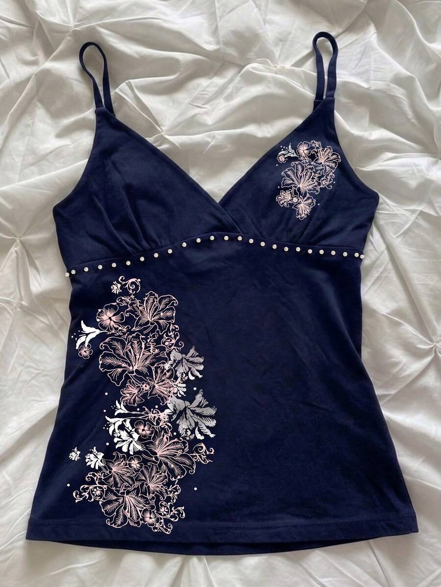 Women's slim fit spaghetti strap cami top featuring a tropical hibiscus floral graphic print.