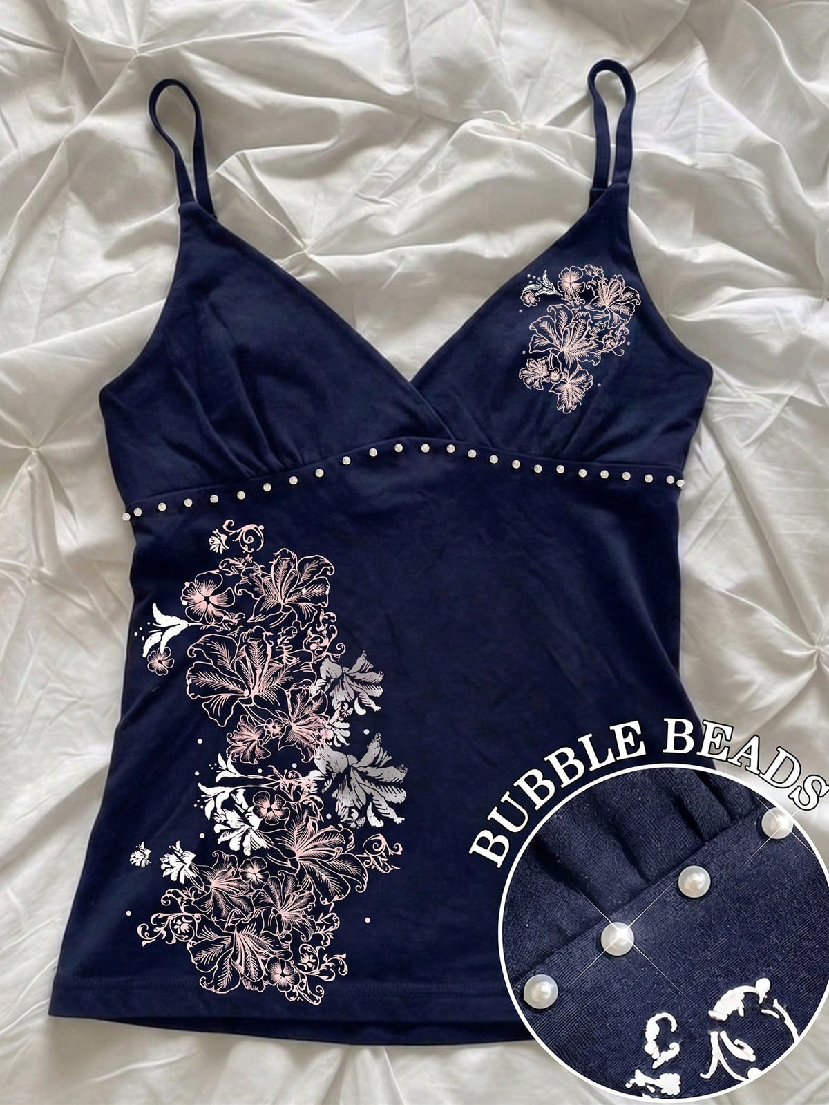 Women's slim fit spaghetti strap cami top featuring a tropical hibiscus floral graphic print.