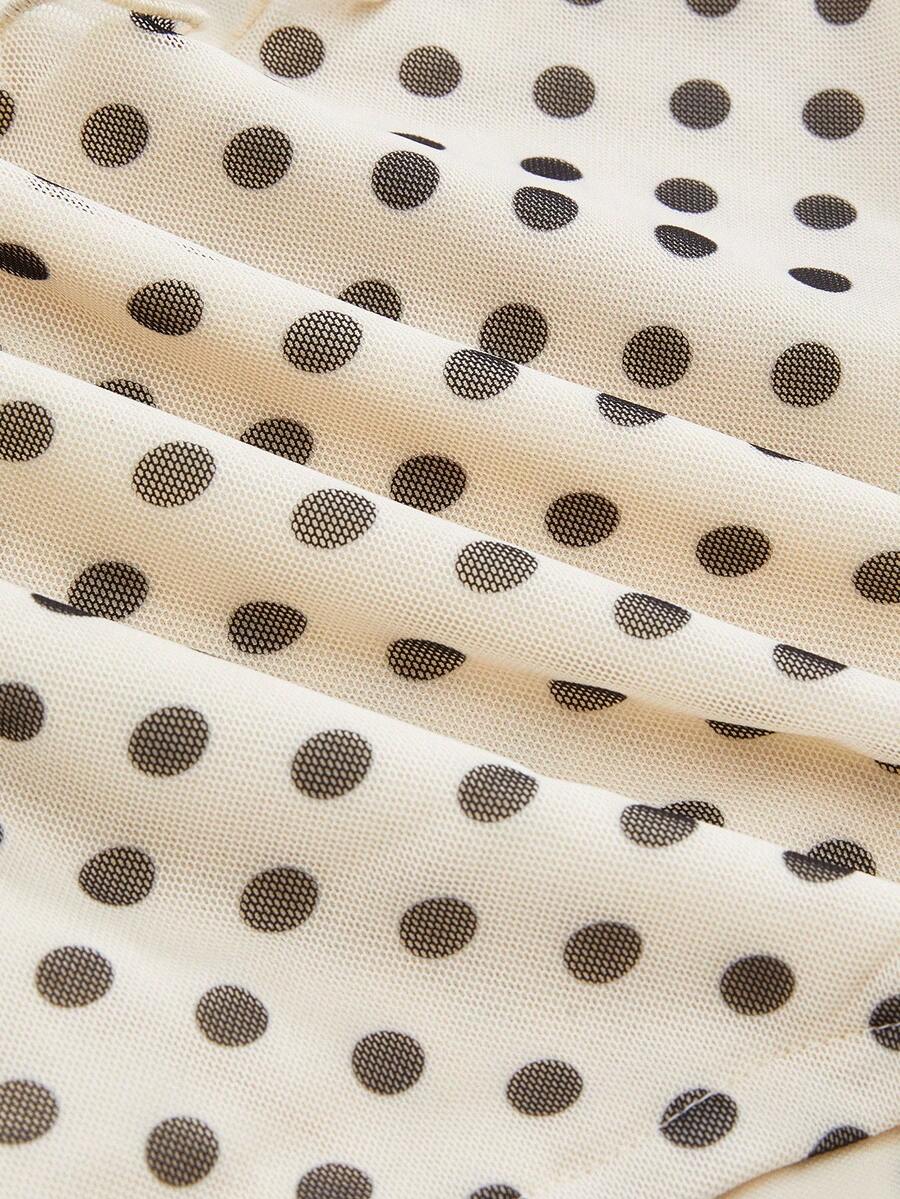Women's black polka dot strapless tube top made of ruched mesh fabric featuring an asymmetrical hem and matching scarf.