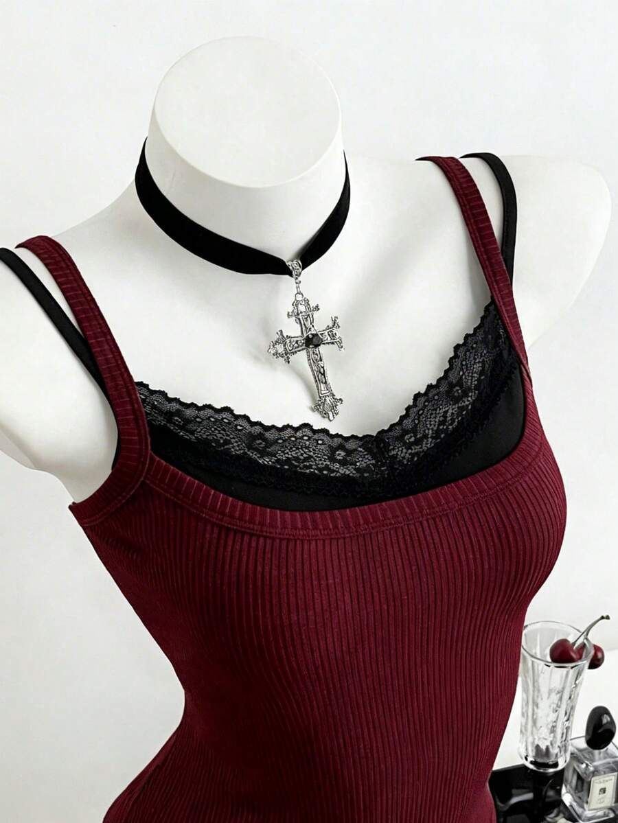 Women's slim fit spaghetti strap cami tank top with contrast lace trim along the neckline